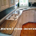 Vyara Granite with white cabinets